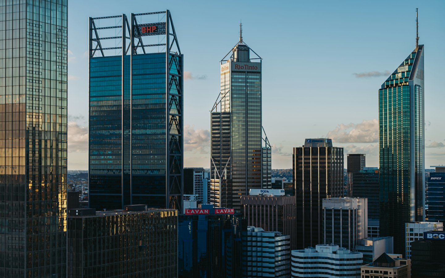 Modern skyscrapers in a financial district on a clear day.